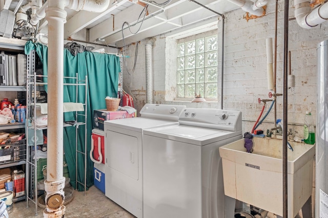 washroom with sink and separate washer and dryer