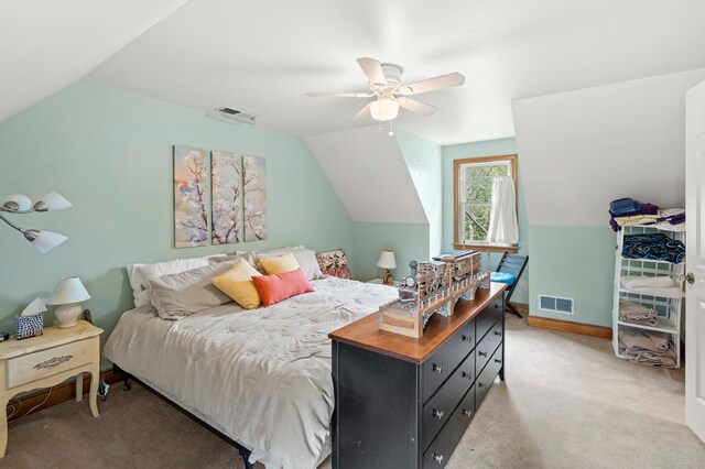 bedroom featuring vaulted ceiling, light colored carpet, and ceiling fan