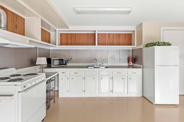 kitchen with sink, decorative backsplash, white cabinetry, and white appliances