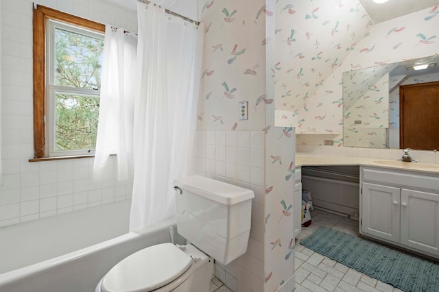 full bathroom with toilet, tile walls, vanity, shower / bathtub combination with curtain, and tile patterned flooring