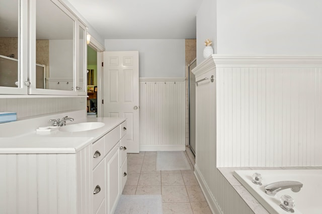 bathroom with vanity, shower with separate bathtub, and tile patterned flooring