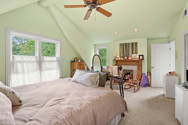 carpeted bedroom featuring ceiling fan, lofted ceiling, and multiple windows