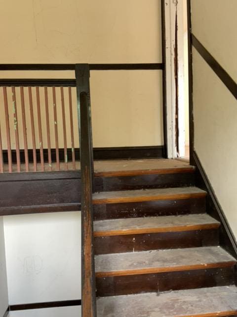 stairs with concrete flooring