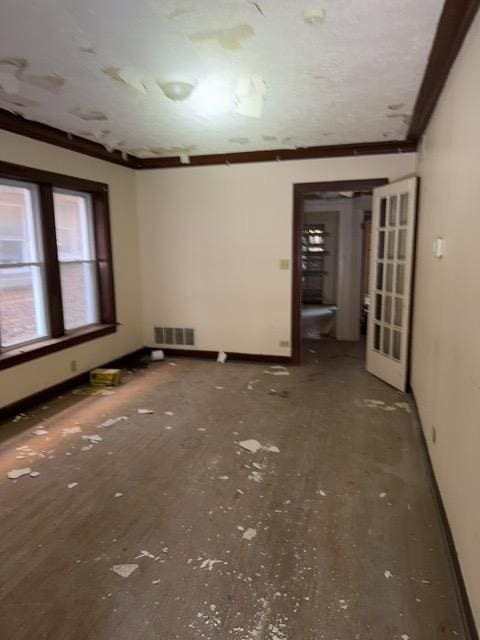 unfurnished room featuring ornamental molding