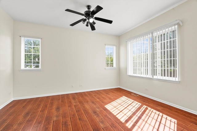 spare room featuring ceiling fan and hardwood / wood-style flooring