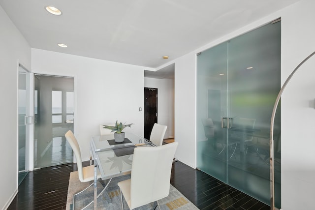 dining area featuring dark hardwood / wood-style flooring