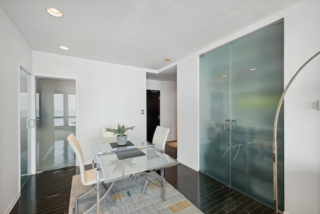 dining space with dark wood-type flooring