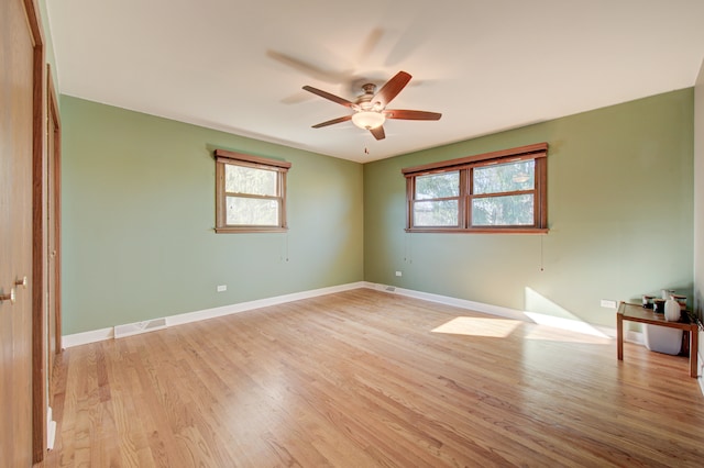 spare room with light hardwood / wood-style floors and ceiling fan