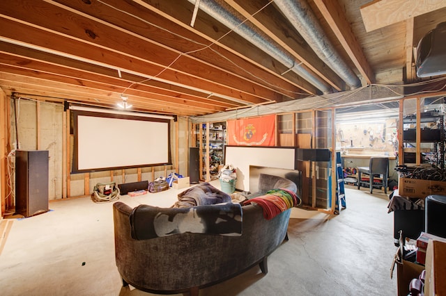 home theater room featuring concrete floors