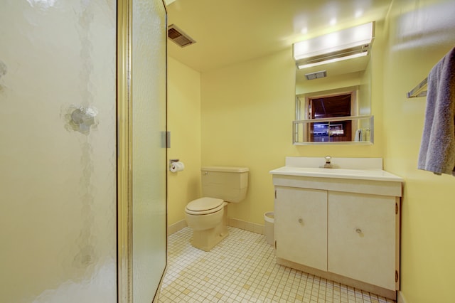 bathroom with walk in shower, tile patterned flooring, vanity, and toilet