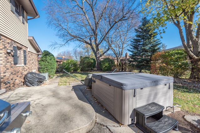 view of patio with a hot tub