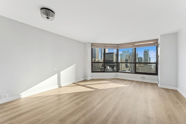 unfurnished room featuring light hardwood / wood-style flooring