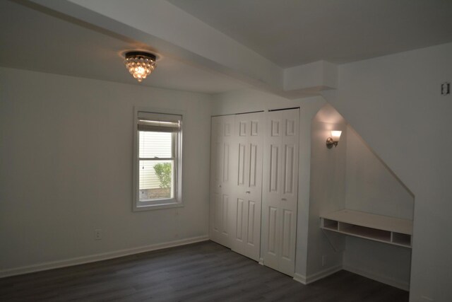 unfurnished bedroom featuring dark hardwood / wood-style floors