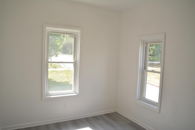 unfurnished room with light hardwood / wood-style flooring