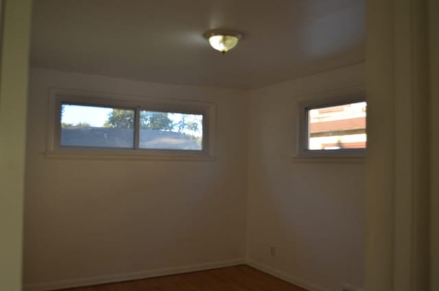 empty room featuring dark wood-type flooring