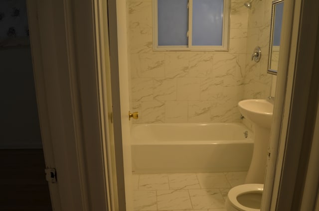 bathroom with toilet and shower / bathtub combination