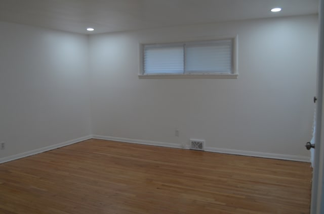 empty room featuring hardwood / wood-style flooring