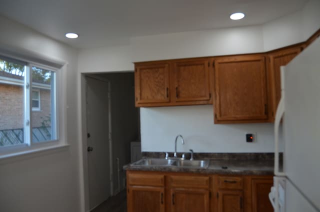 kitchen featuring sink and white refrigerator