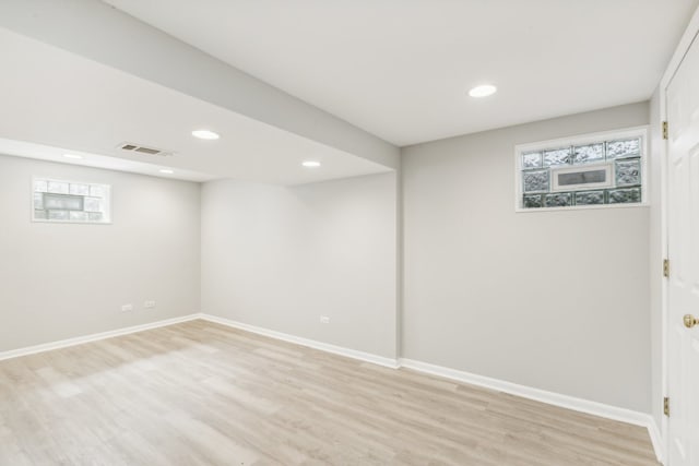 basement featuring light hardwood / wood-style flooring