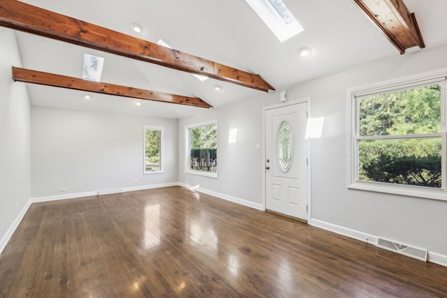 entryway with dark wood-type flooring and lofted ceiling with skylight