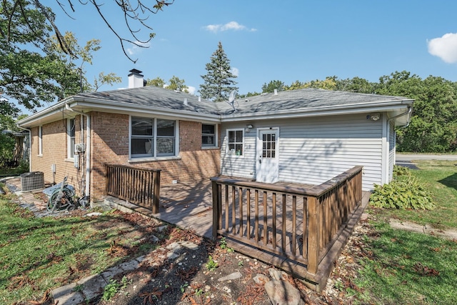 back of house featuring a wooden deck and cooling unit