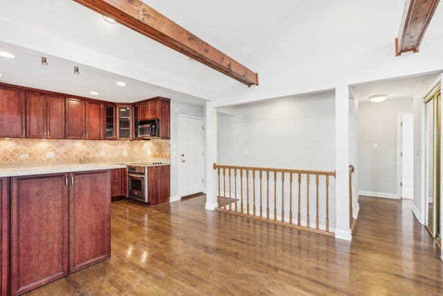 kitchen featuring tasteful backsplash, beam ceiling, appliances with stainless steel finishes, dark wood-type flooring, and light stone counters