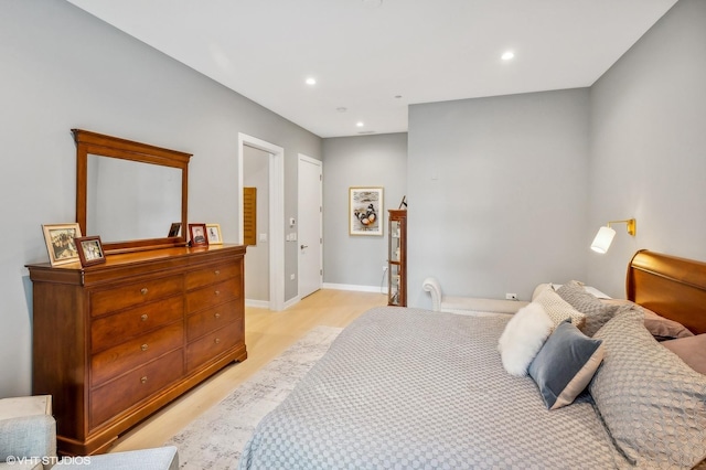 bedroom featuring light wood-style flooring, recessed lighting, and baseboards
