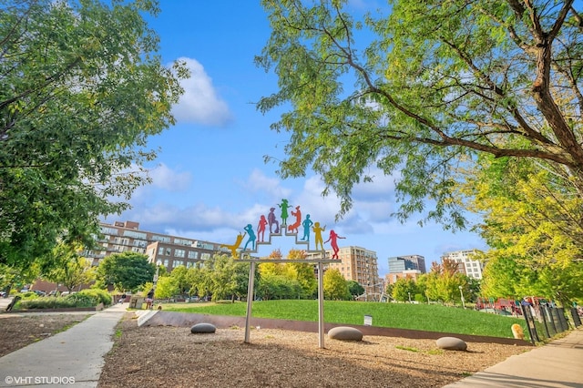 communal playground featuring a lawn
