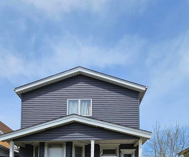 view of property exterior featuring a porch