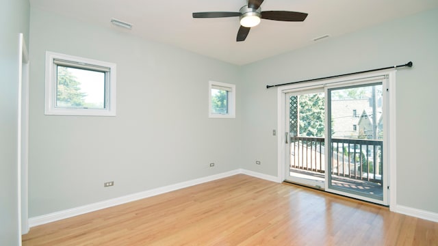 unfurnished room with ceiling fan, light hardwood / wood-style floors, and a wealth of natural light