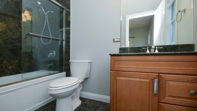 full bathroom with enclosed tub / shower combo, tile patterned flooring, vanity, and toilet