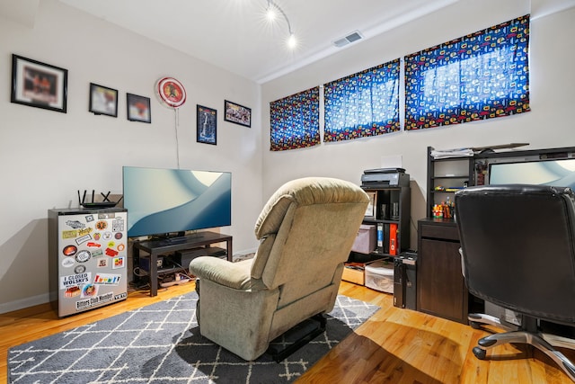 office space with hardwood / wood-style flooring