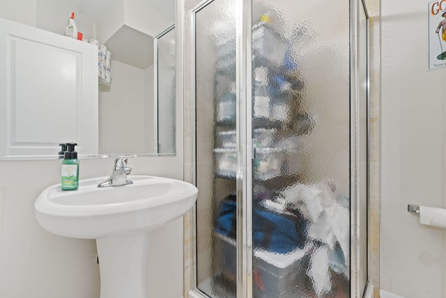 bathroom with a shower with shower door