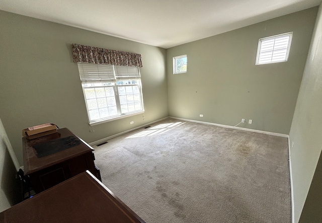 spare room featuring carpet flooring