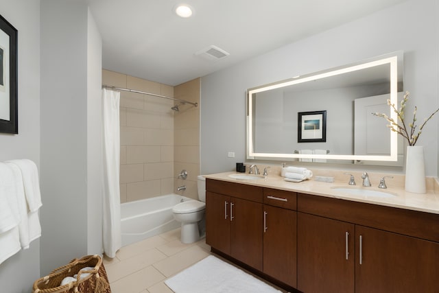 full bathroom with tile patterned floors, shower / bath combo, toilet, and vanity