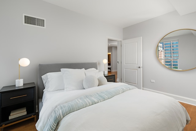 bedroom featuring dark hardwood / wood-style floors