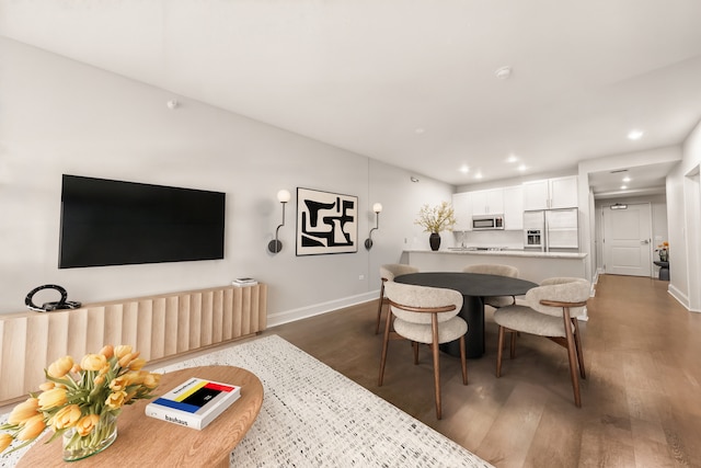 dining room with dark wood-type flooring