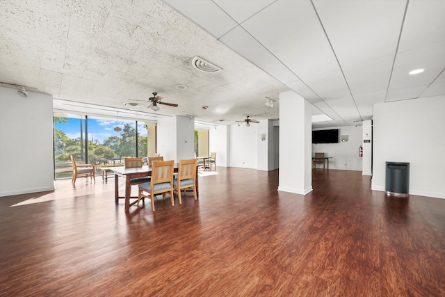 dining area featuring wood-type flooring and ceiling fan