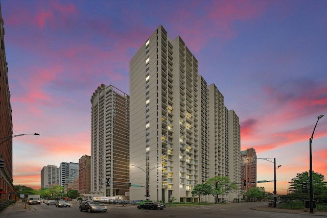 view of outdoor building at dusk