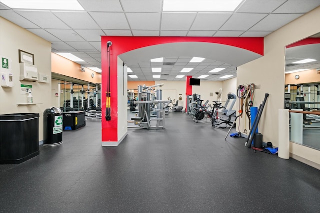 exercise room with a paneled ceiling