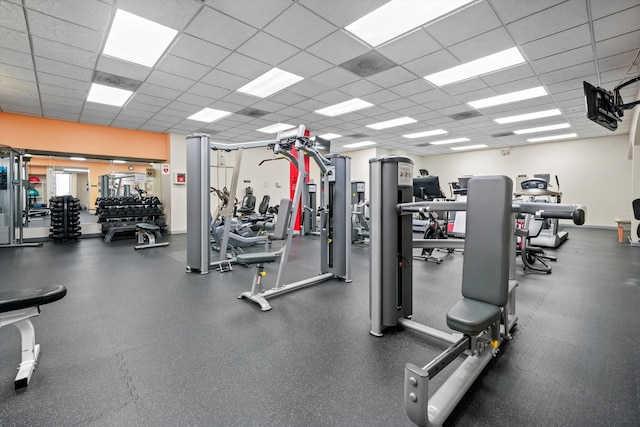 exercise room featuring a paneled ceiling