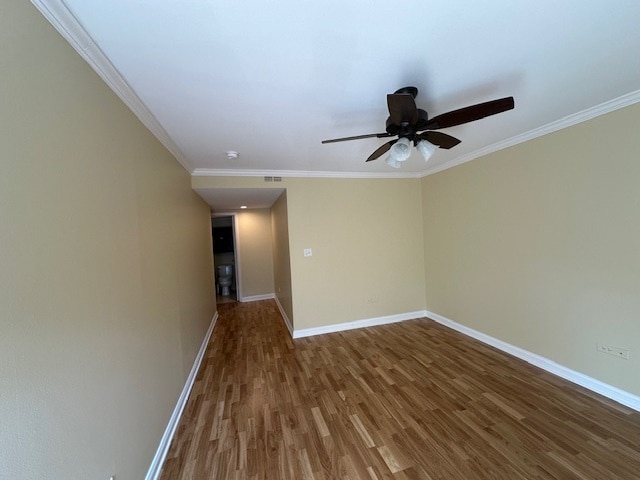 unfurnished room with hardwood / wood-style floors, ceiling fan, and ornamental molding