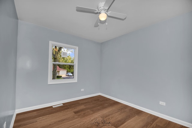 empty room featuring hardwood / wood-style flooring and ceiling fan