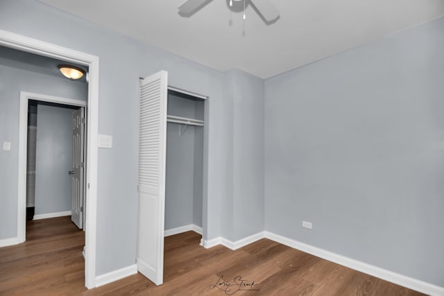 unfurnished bedroom featuring ceiling fan, a closet, and wood-type flooring