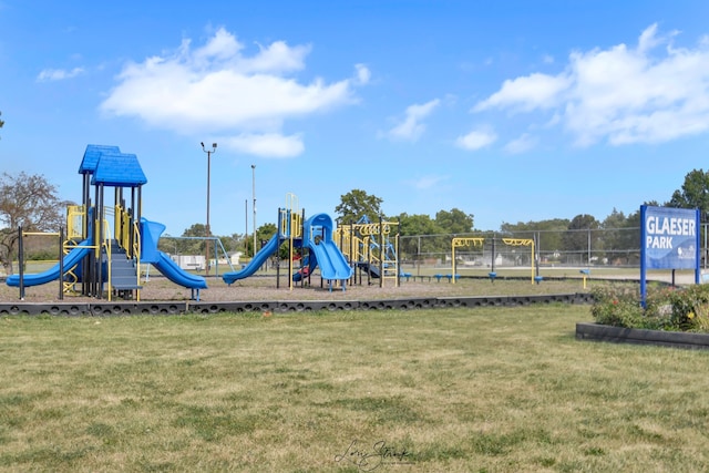 view of playground with a yard