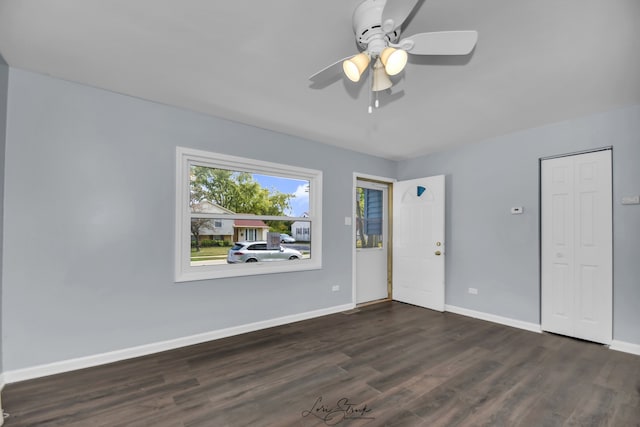 interior space featuring a closet, ceiling fan, and dark hardwood / wood-style flooring