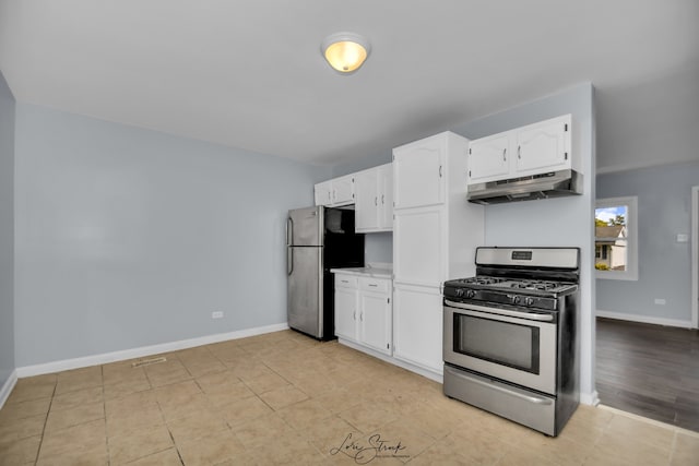 kitchen featuring stainless steel appliances and white cabinets