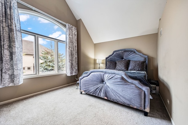 carpeted bedroom featuring vaulted ceiling