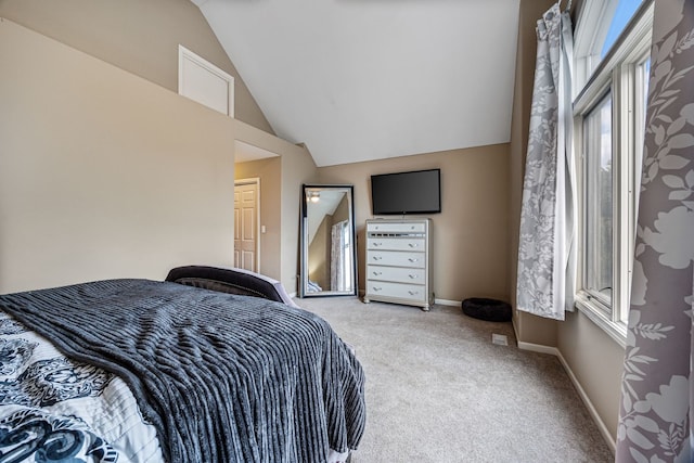 bedroom with light carpet and vaulted ceiling