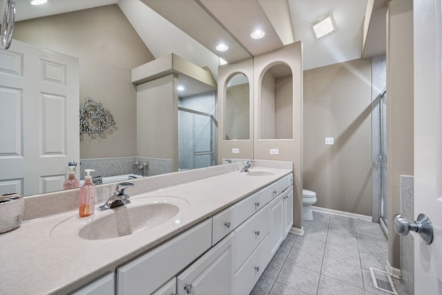 bathroom featuring vanity, toilet, tile patterned floors, vaulted ceiling, and a shower with door